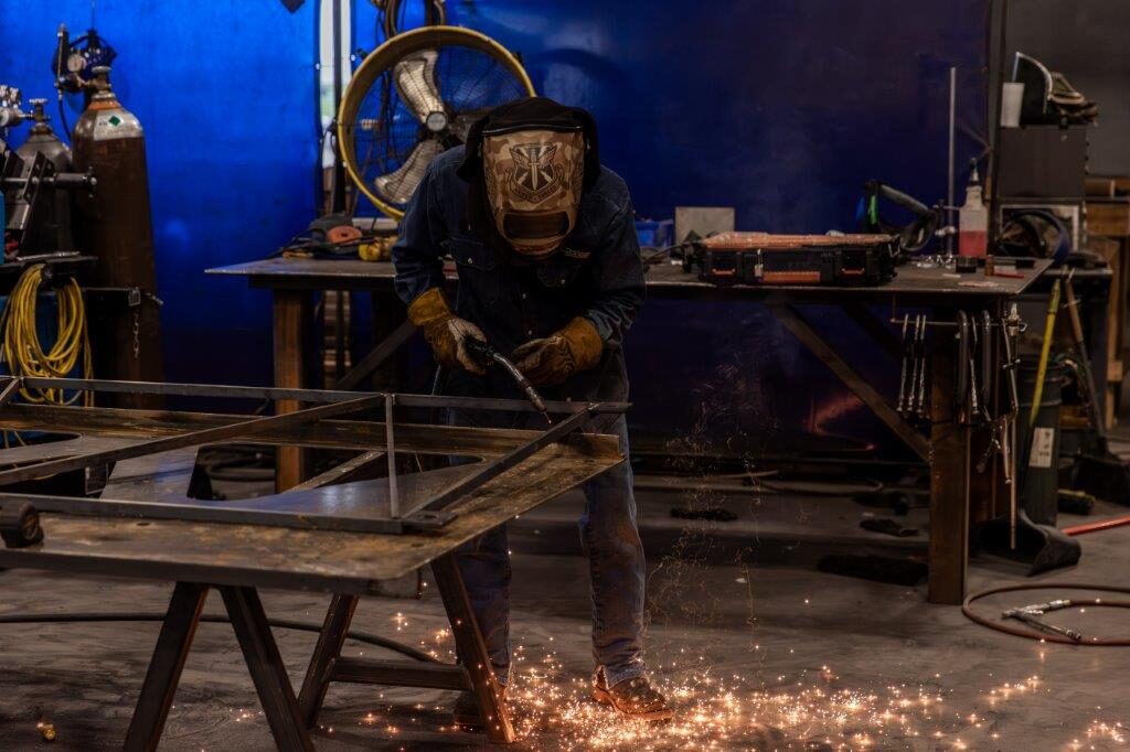Hand welder at work