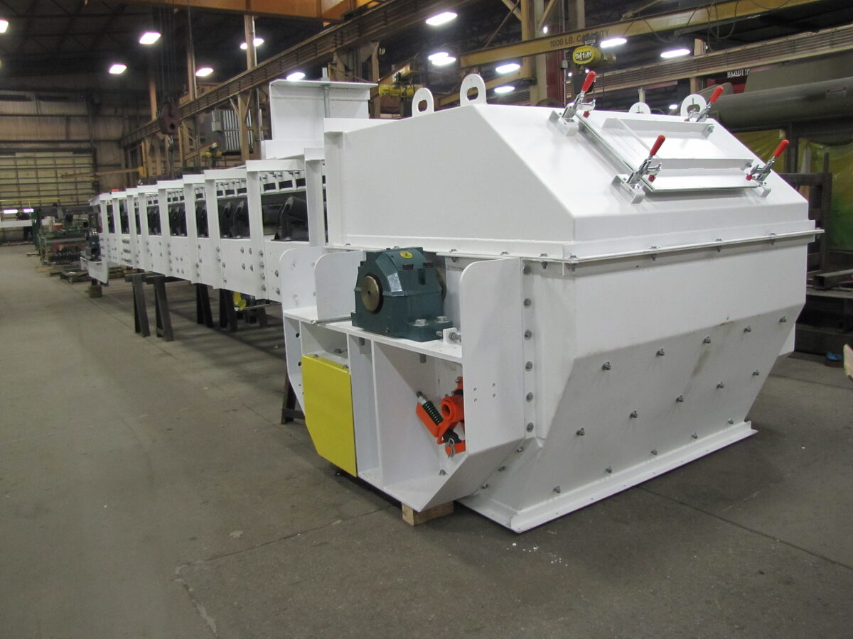 Fully enclosed Orthman belt conveyor with covered head section in the Cleburne shop